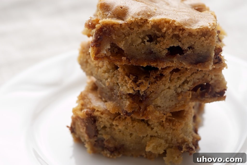 stack of Candy Bar Blondies on a white plate