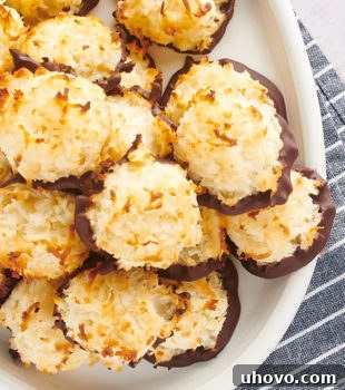overhead view of Coconut Macaroons piled on a white serving plate