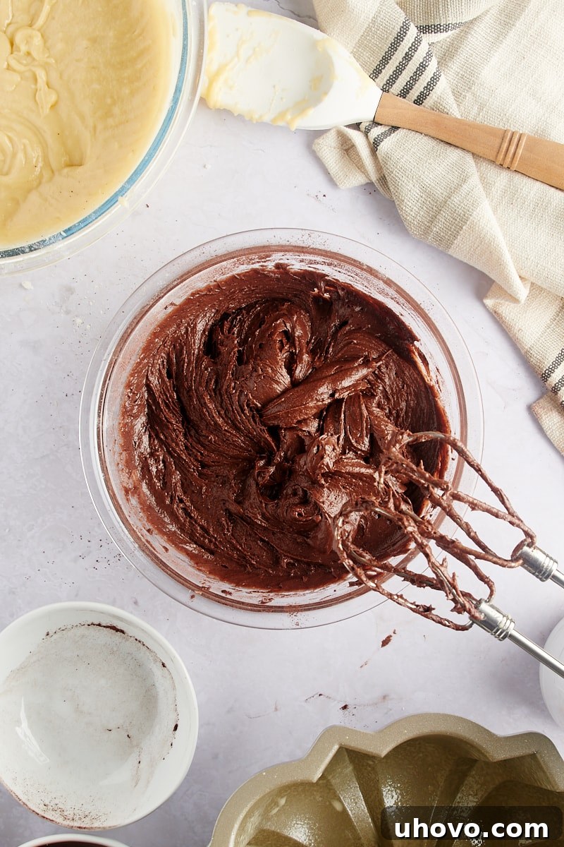 overhead view of the mixed chocolate batter for Marble Bundt Cake, smooth and rich