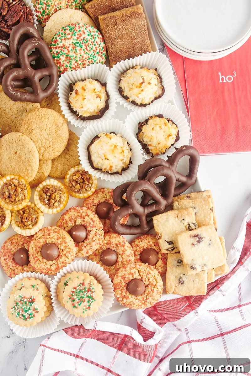 An overhead shot showcasing a diverse Christmas cookie tray filled with a delightful assortment of cookies and sweet treats, creating a feast for the eyes.