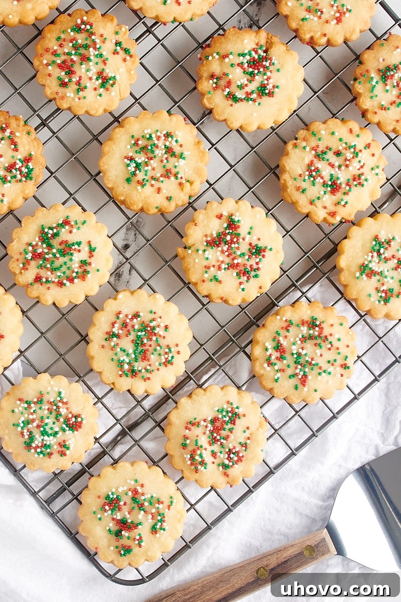 Overhead view of shortbread cookies cooling on a wire rack.