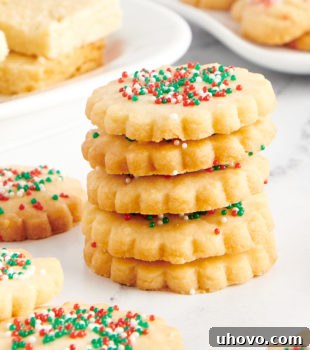 stack of shortbread cookies surrounded by more cookies