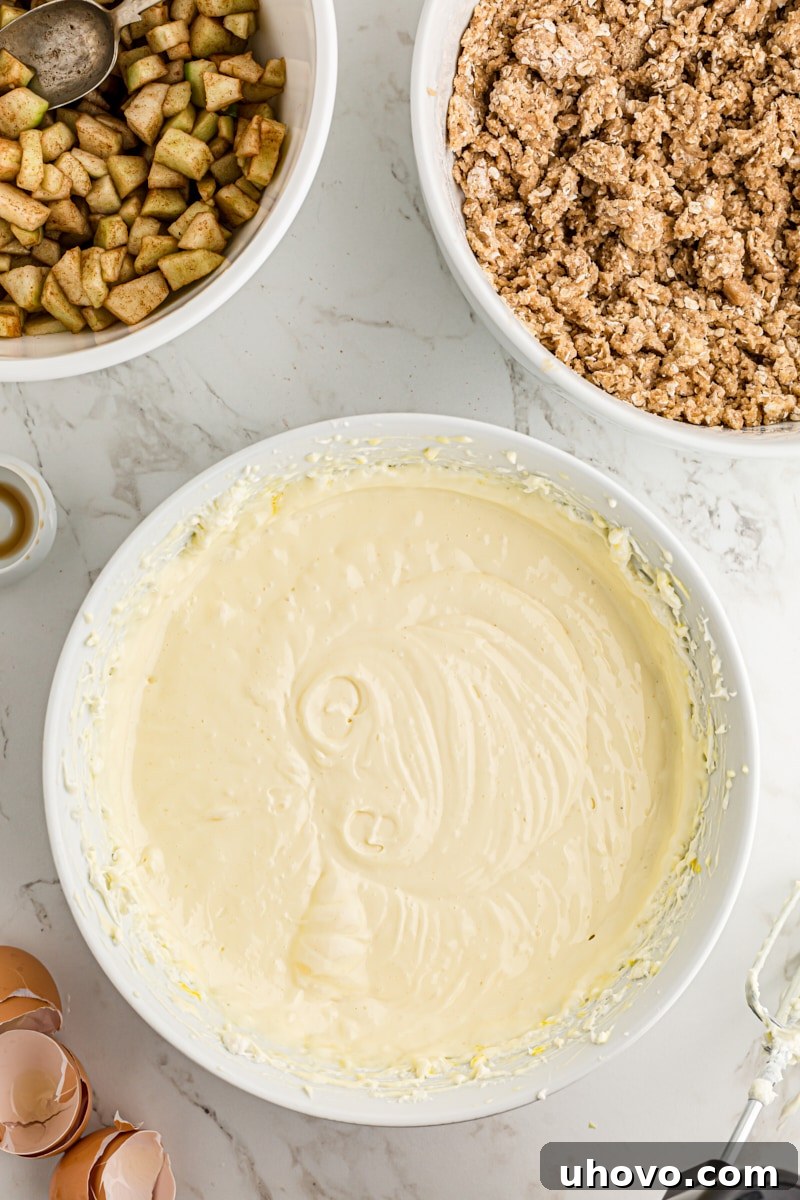 overhead view of mixed cheesecake filling for Caramel Apple Cheesecake Bars