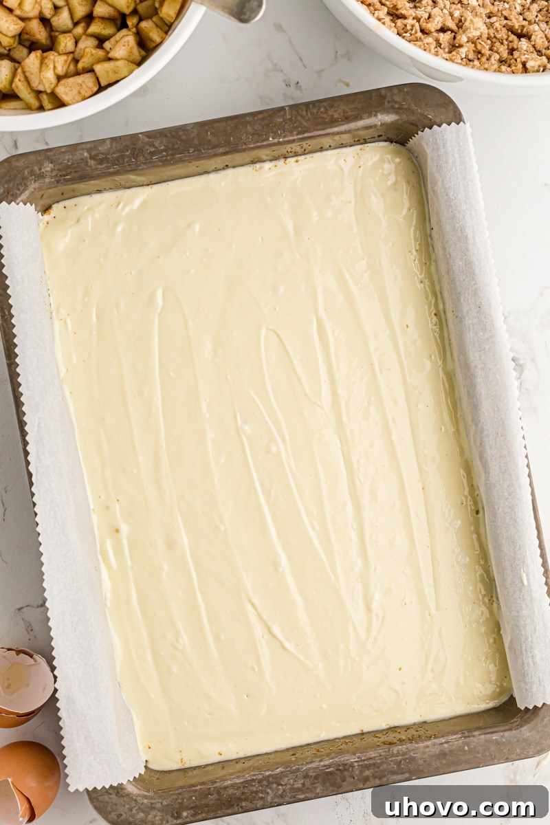 overhead view of cheesecake filling in a 9x13 pan