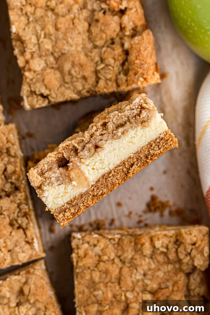 overhead view of sliced Caramel Apple Cheesecake Bars on parchment paper
