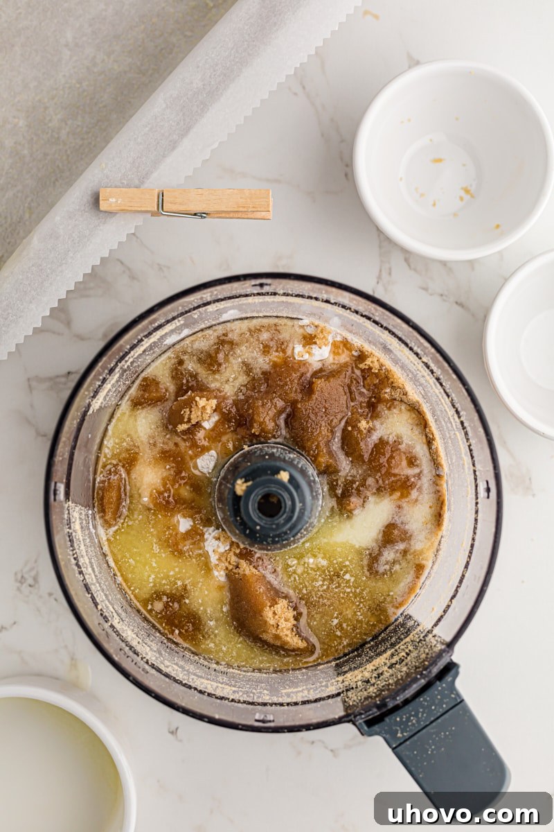 overhead view of graham cracker crust ingredients in a food processor