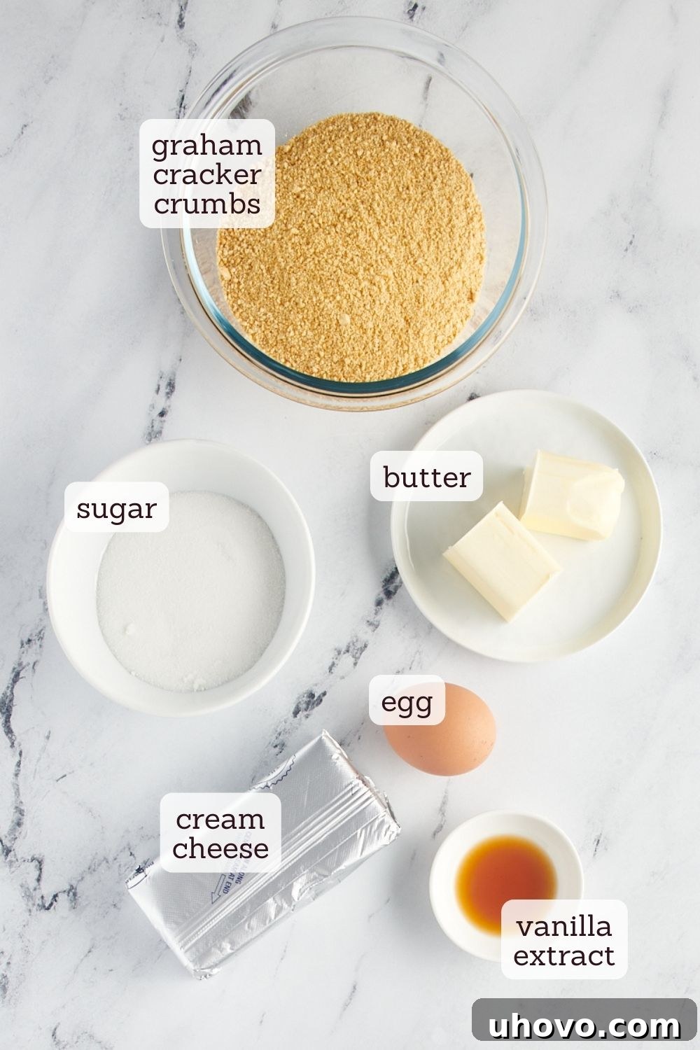 An overhead shot showcasing the fresh ingredients laid out for making mini cheesecakes, highlighting the simplicity and quality.