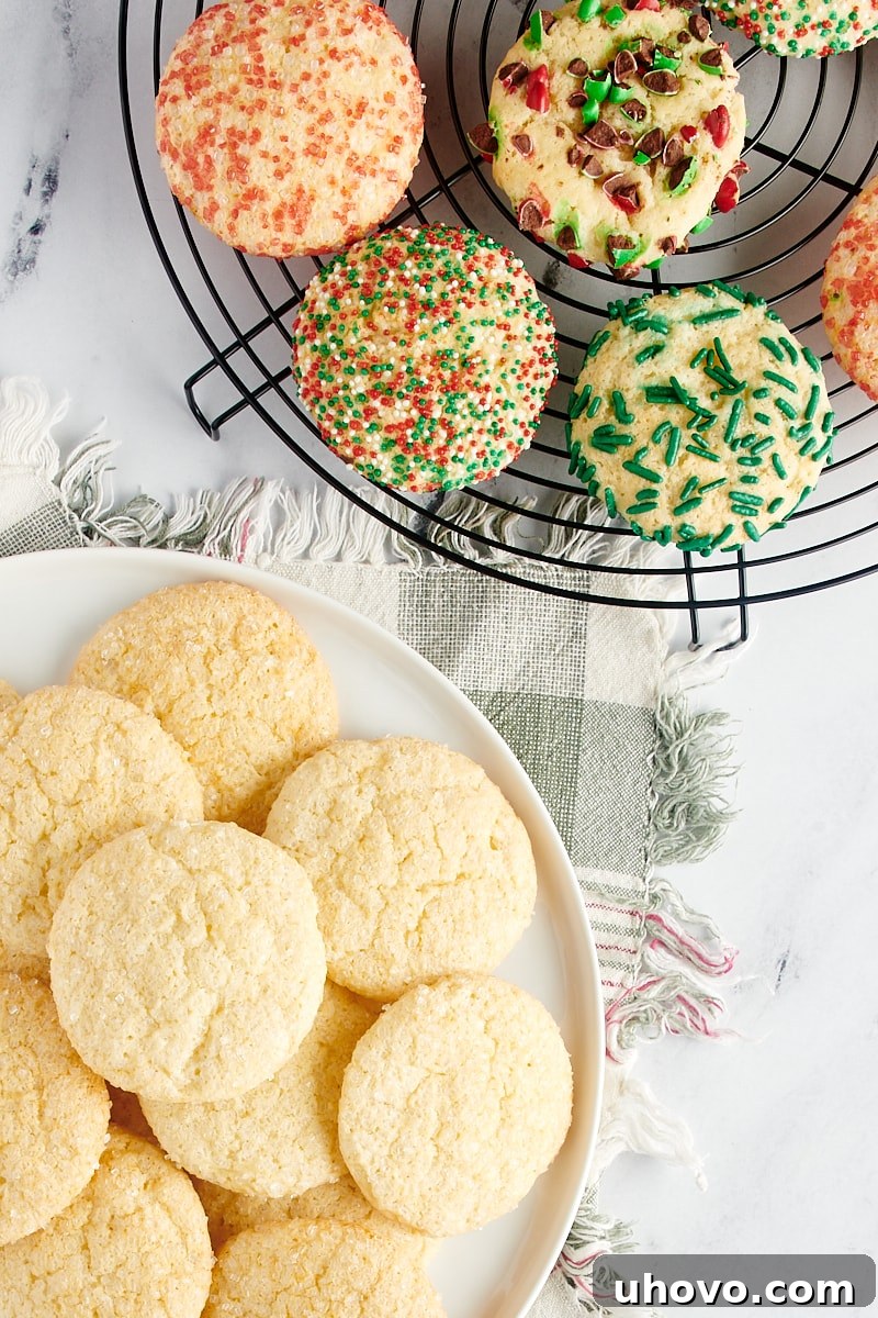 Sugar cookies on a wire rack and a large white plate.