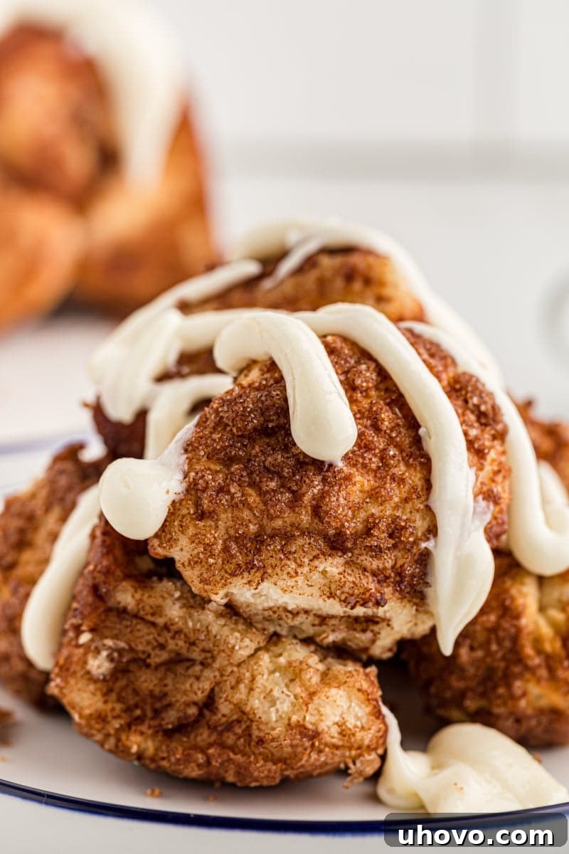 pieces of Monkey Bread topped with cream cheese icing