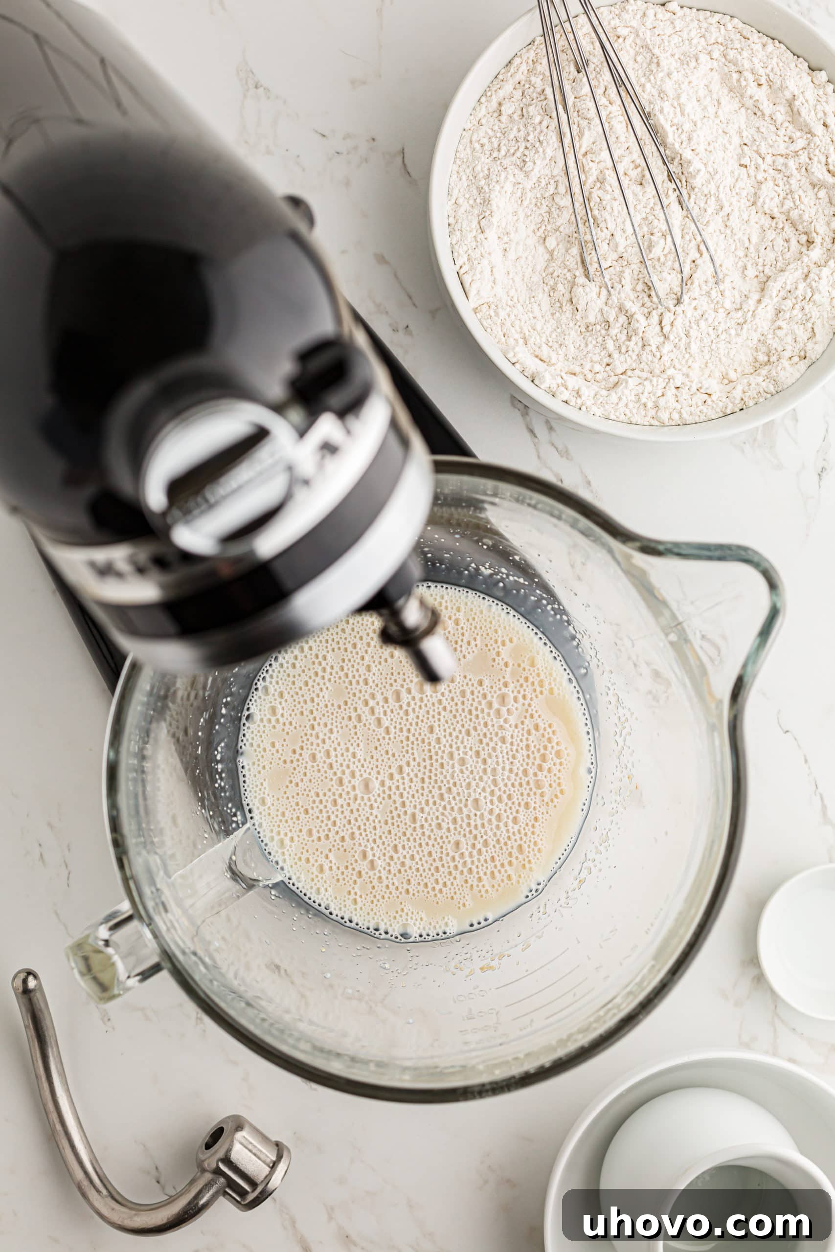 overhead view of initial mixing of Monkey Bread in the bowl of a stand mixer