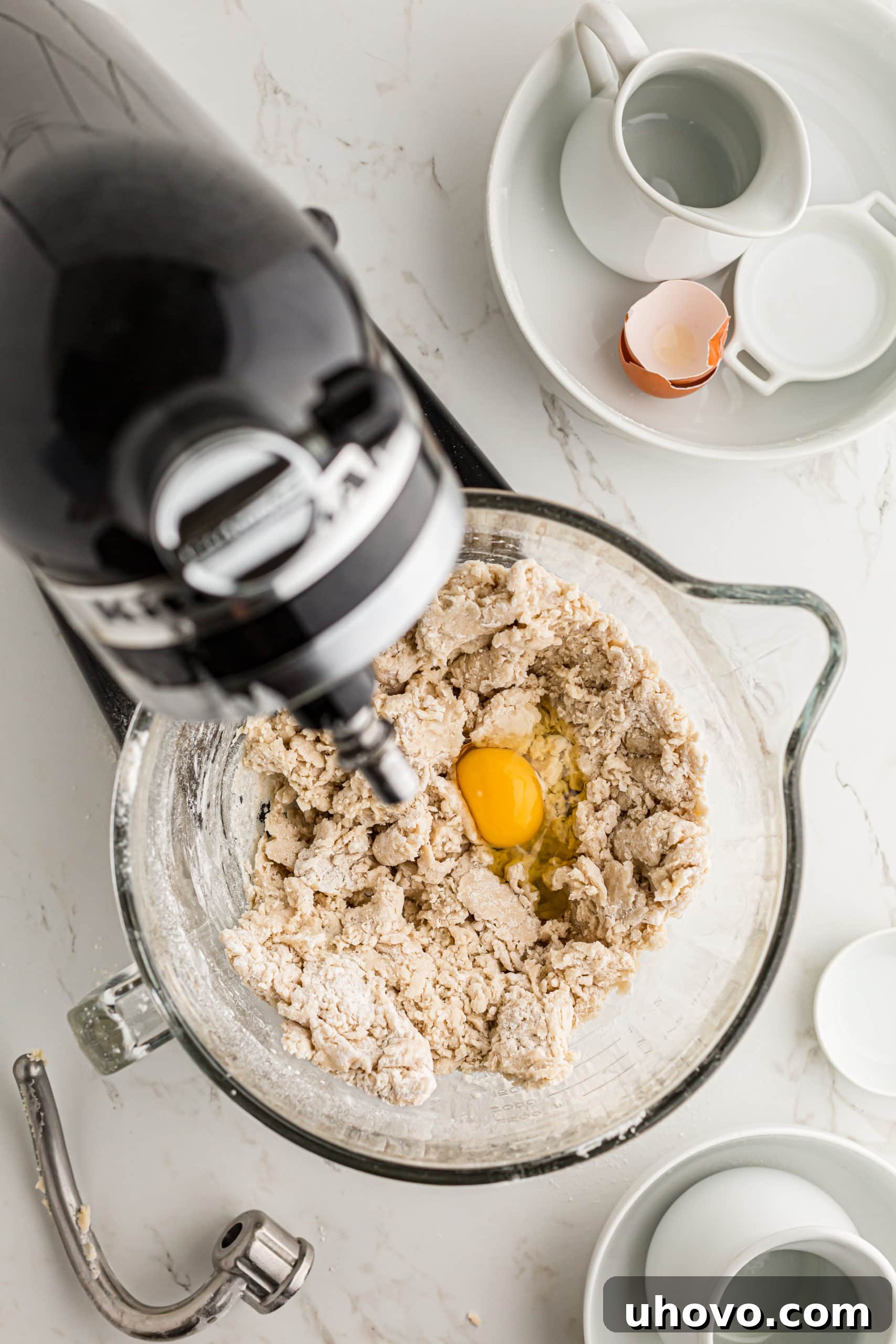 overhead view of egg added to bread dough for Monkey Bread