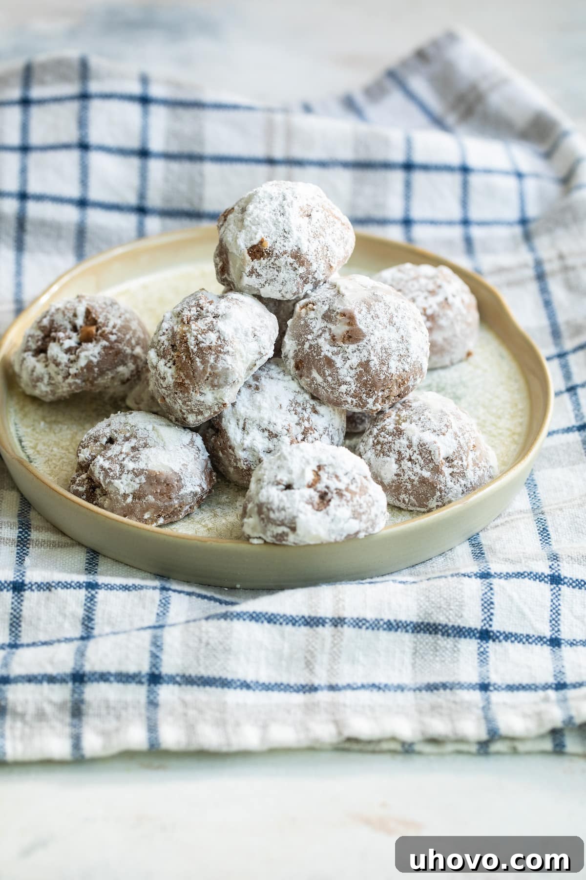 plate of coco macadamia nut cookies on a plaid towel