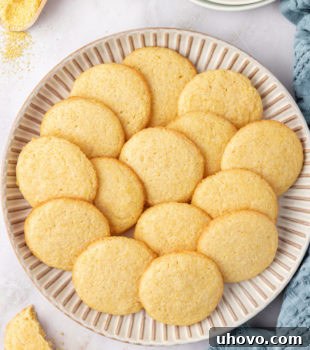 overhead view of cornmeal cookies on a large white plate