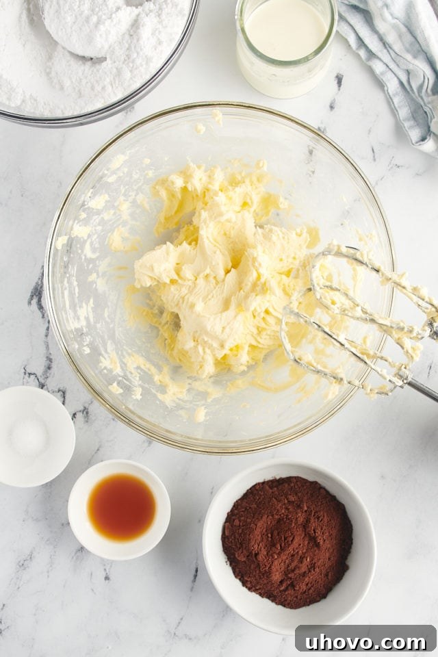 overhead view of creamed butter in a glass mixing bowl