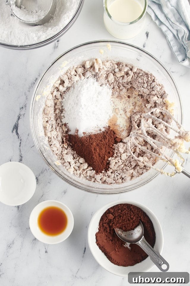 overhead view of partially mixed chocolate buttercream frosting