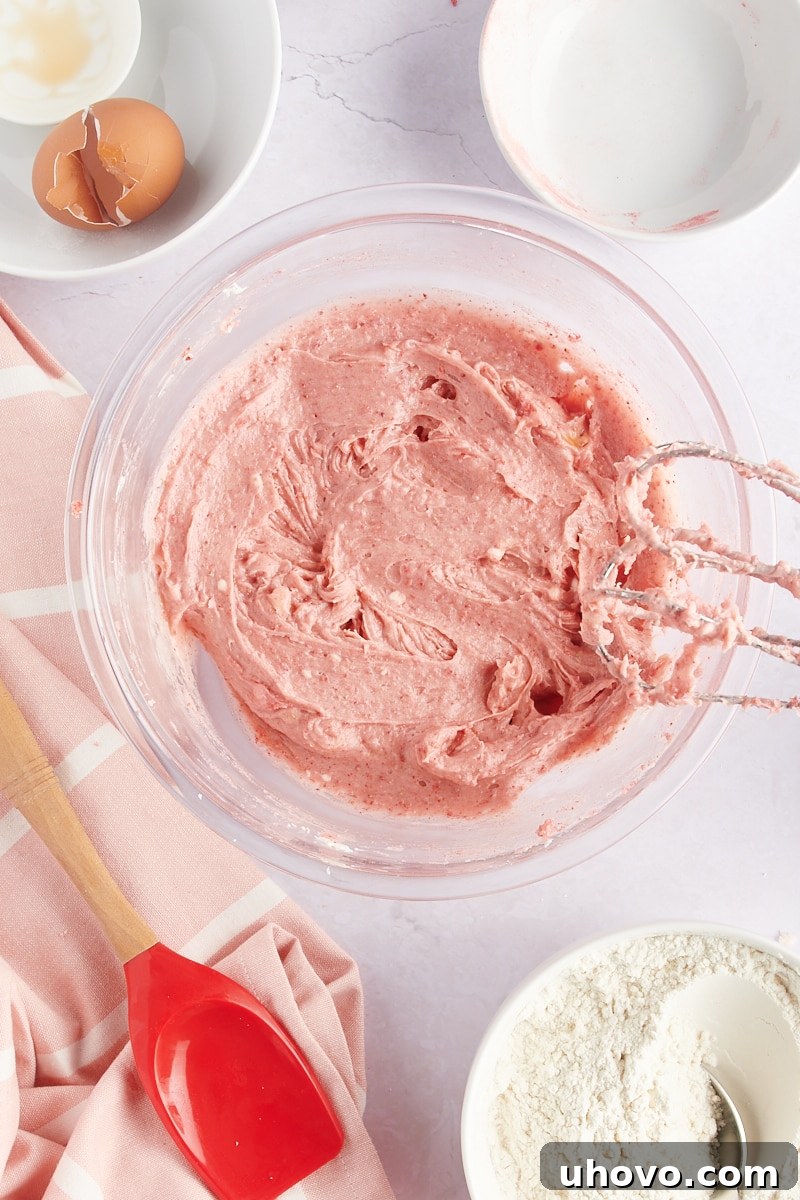 overhead view of partially mixed strawberry cookie dough