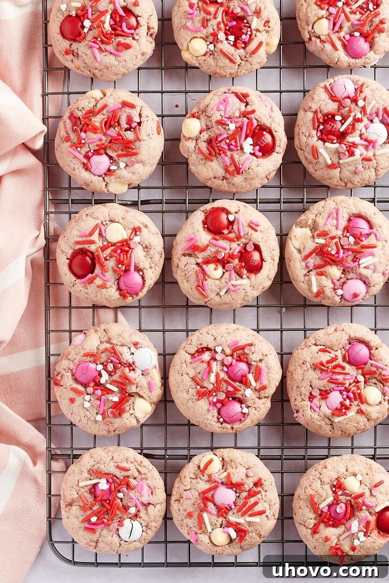 overhead view of Strawberry M&M Cookies on a wire cooling rack