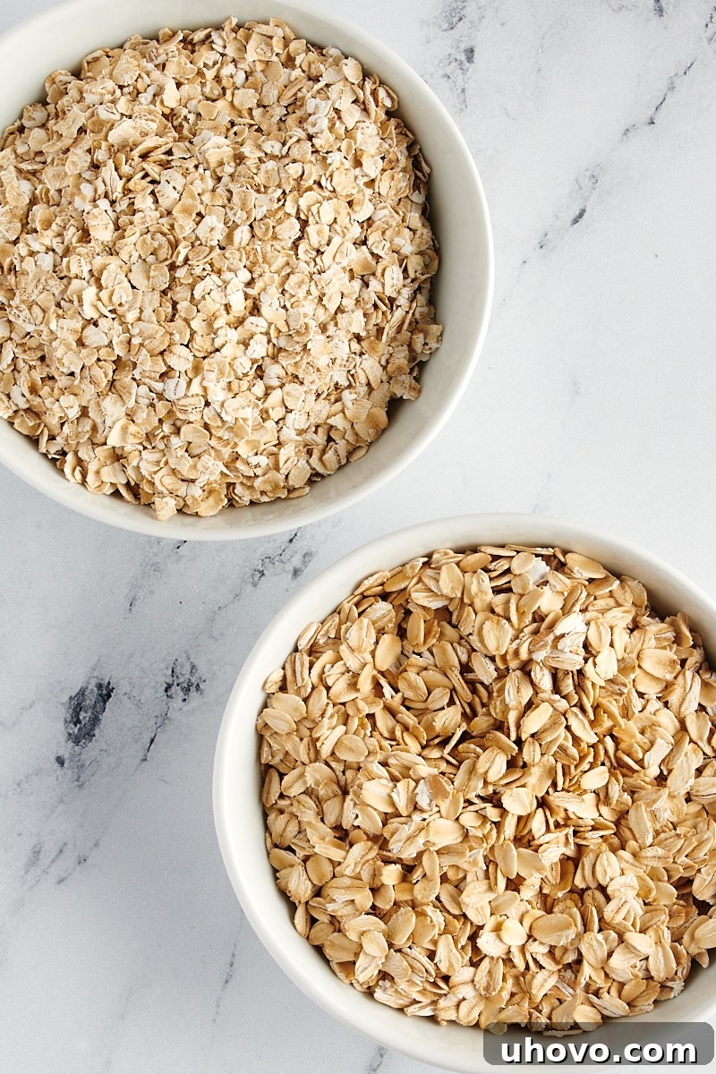 overhead view of a bowl of rolled oats and a bowl of quick oats
