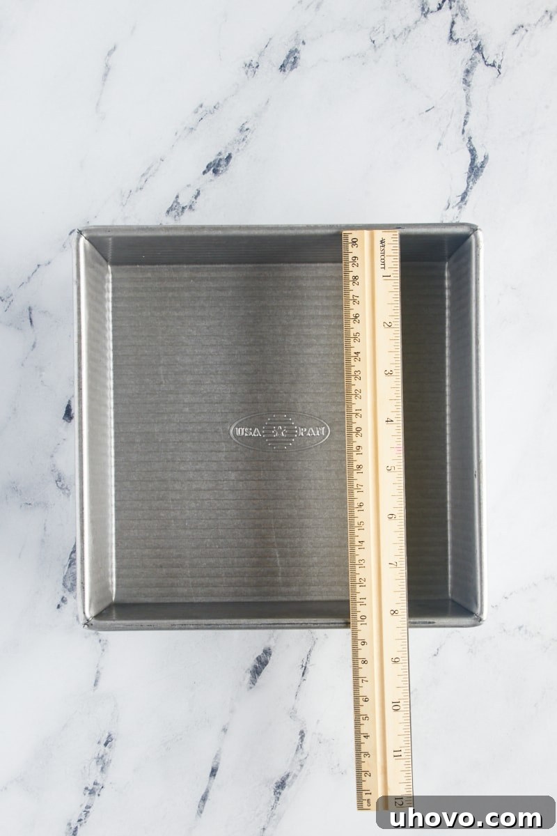 overhead view of a ruler on top of a square baking pan