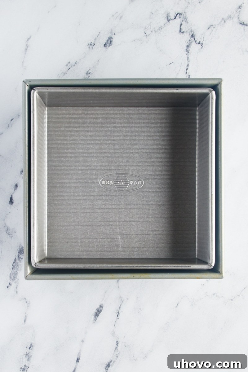 overhead view of an 8-inch square baking pan nested inside a 9-inch square pan