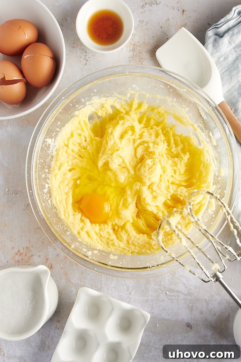 overhead view of the fourth and final egg blended into the cake batter