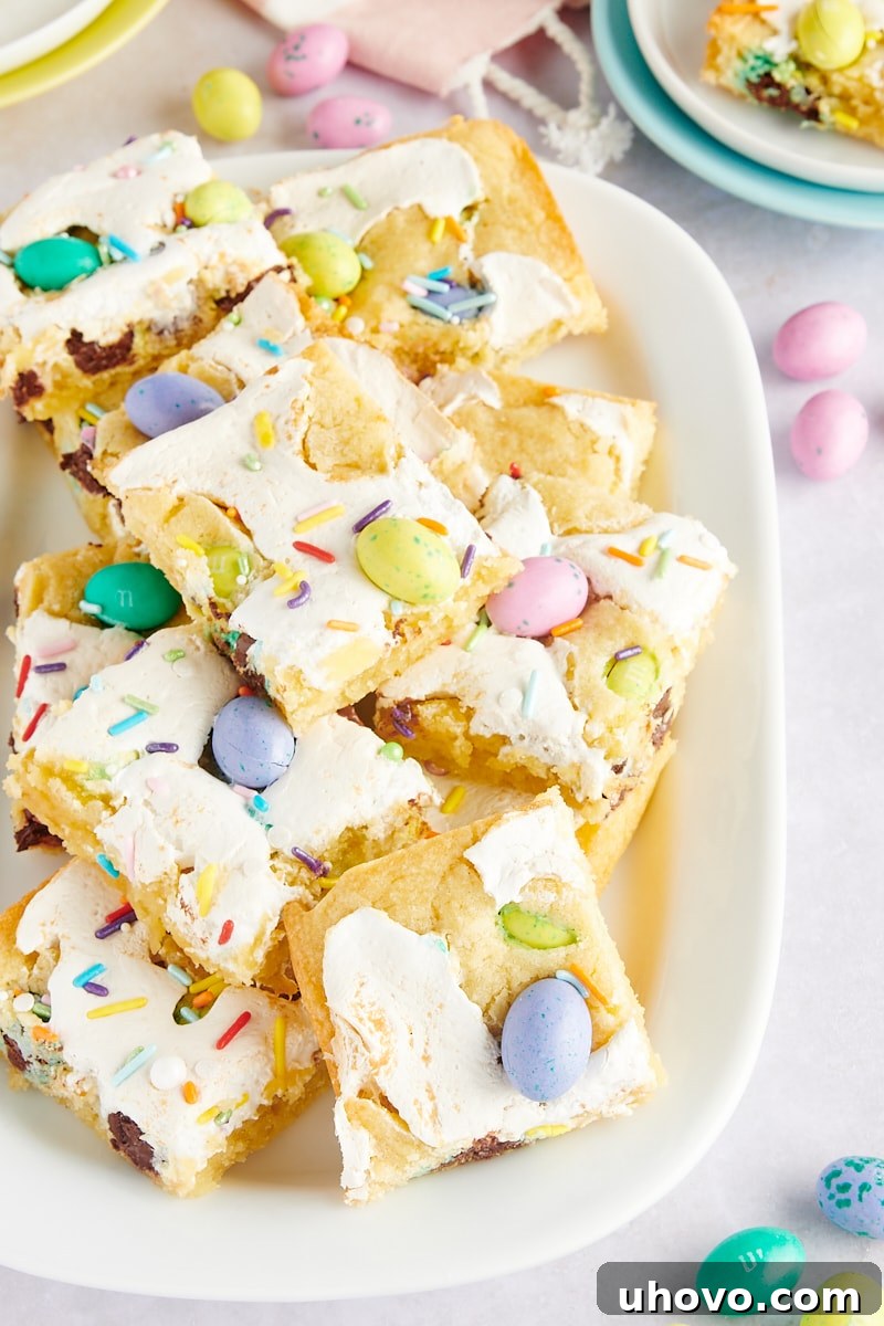 M&M Marshmallow Sugar Cookie Bars on a white serving platter surrounded by more colorful M&Ms, ready to be enjoyed