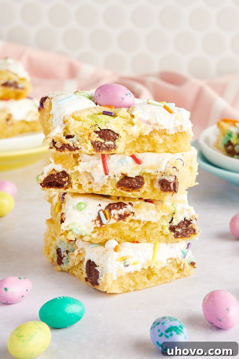 stack of three M&M Marshmallow Sugar Cookie Bars, showing off the layers of cookie, marshmallow, and M&Ms