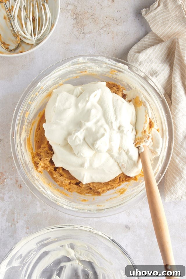 overhead view of remaining whipped cream added to mousse mixture