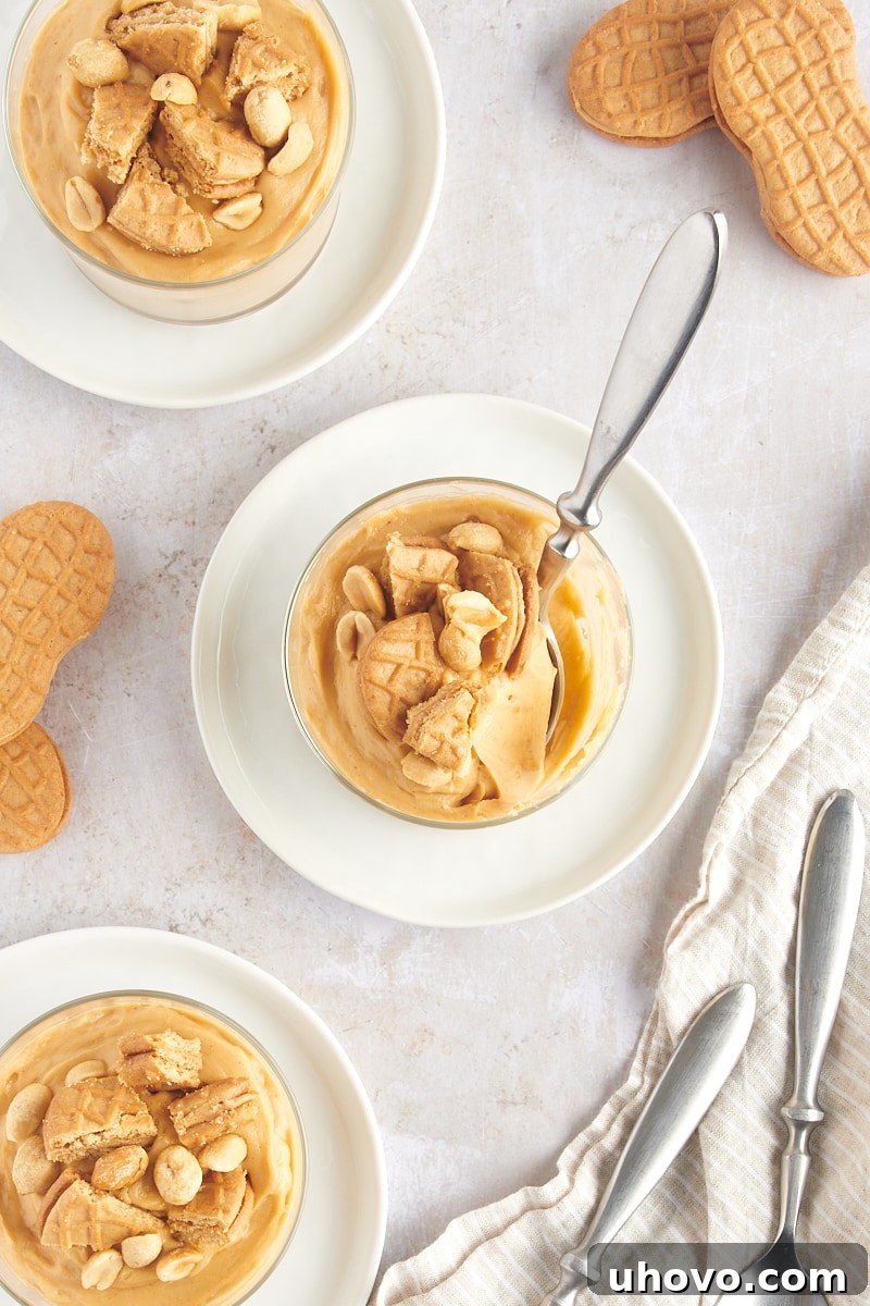 overhead view of three servings of Peanut Butter Mousse in glasses on white plates