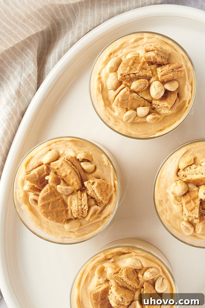 overhead view of servings of Peanut Butter Mousse in clear glasses on a white tray