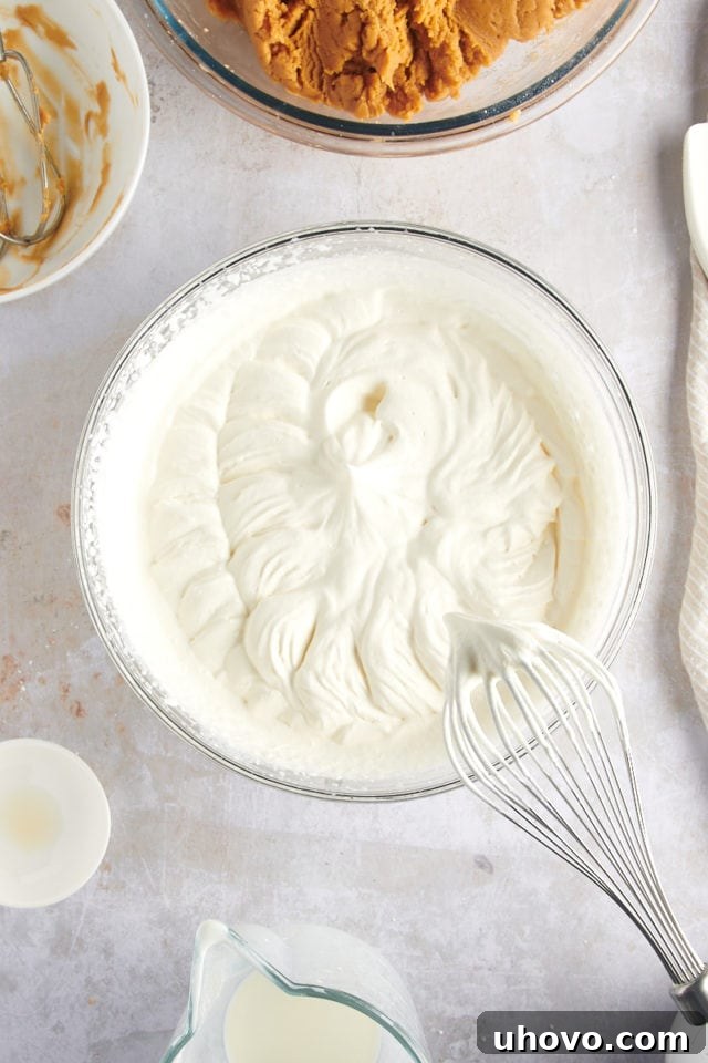 overhead view of whipped cream in a glass bowl