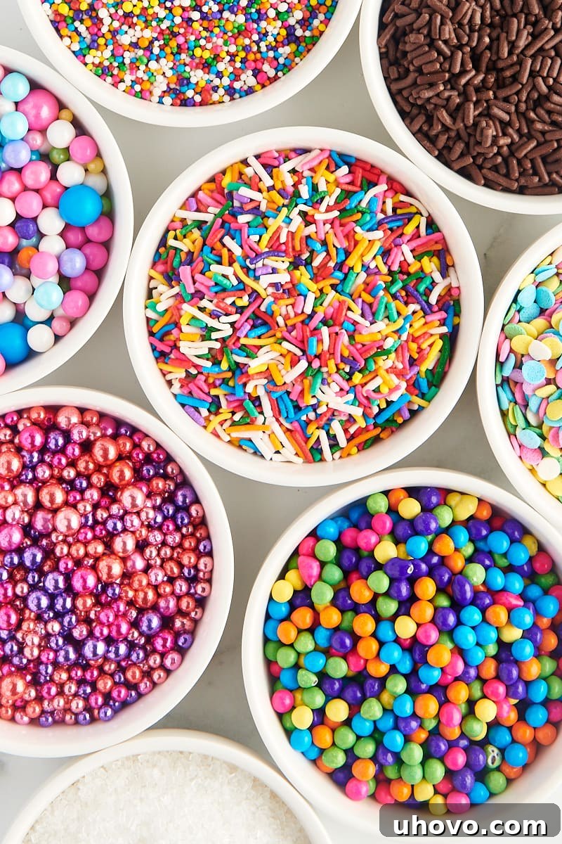 overhead view of a variety of sprinkles in white bowls
