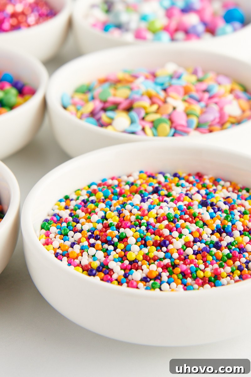 white bowls filled with brightly colored sprinkles