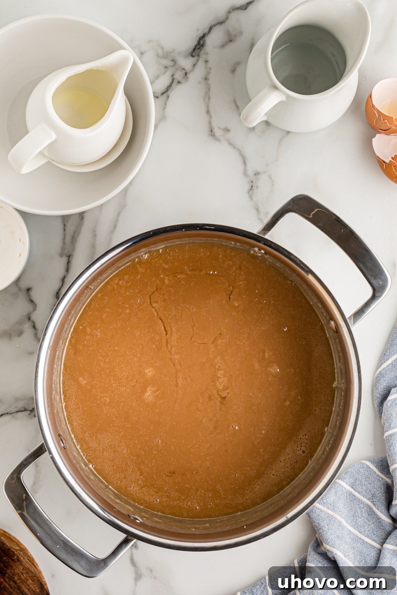 Overhead view of the finished smooth and glossy caramel mixture in a pot