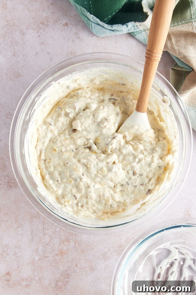 Overhead view of millionaire pie filling in glass mixing bowl