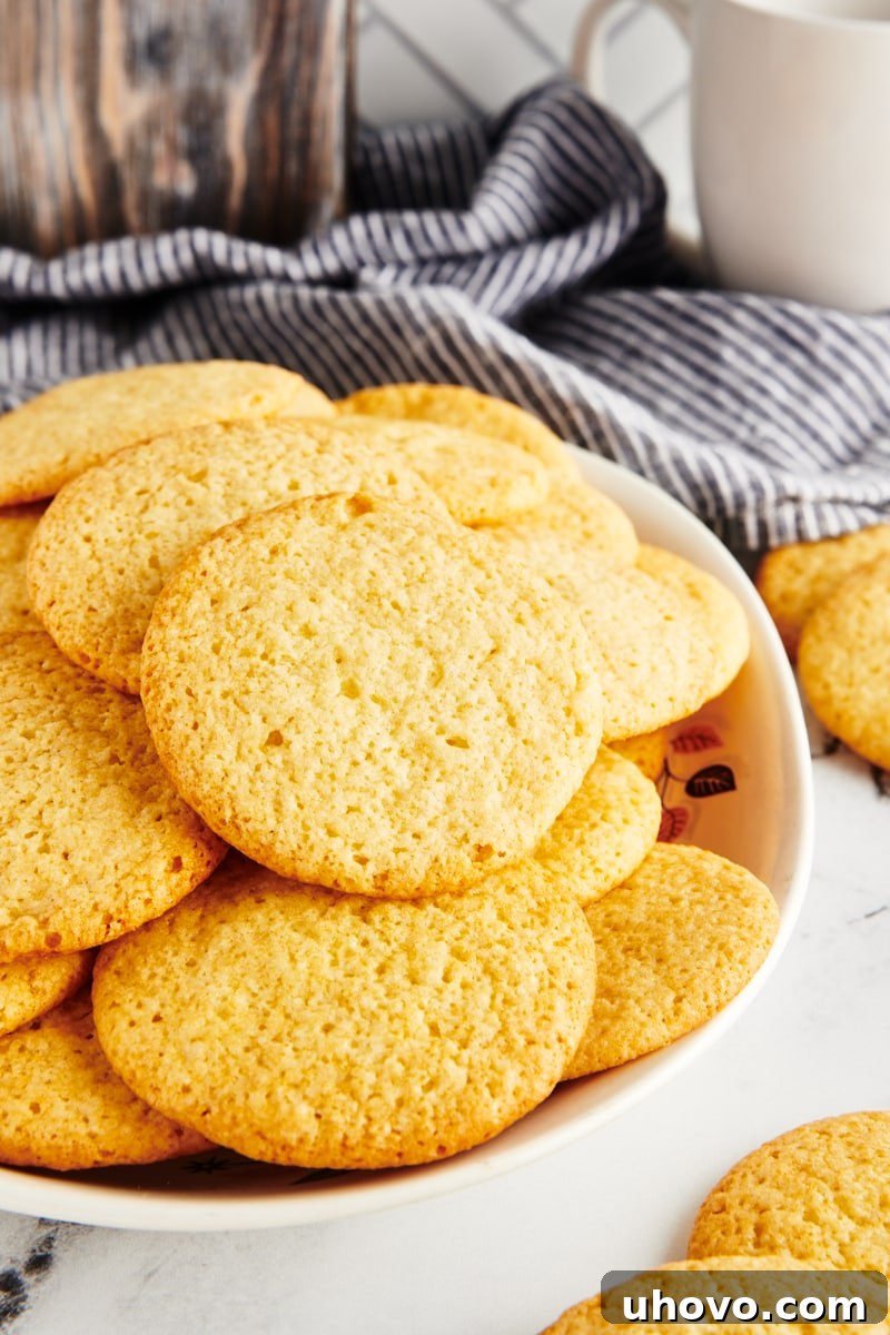 Southern tea cakes piled high on an elegant oval serving tray, ready to be enjoyed.