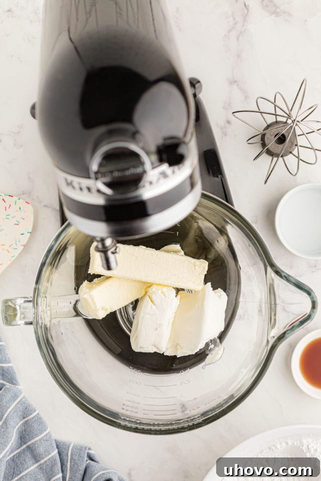 overhead view of butter and shortening in the bowl of a stand mixer