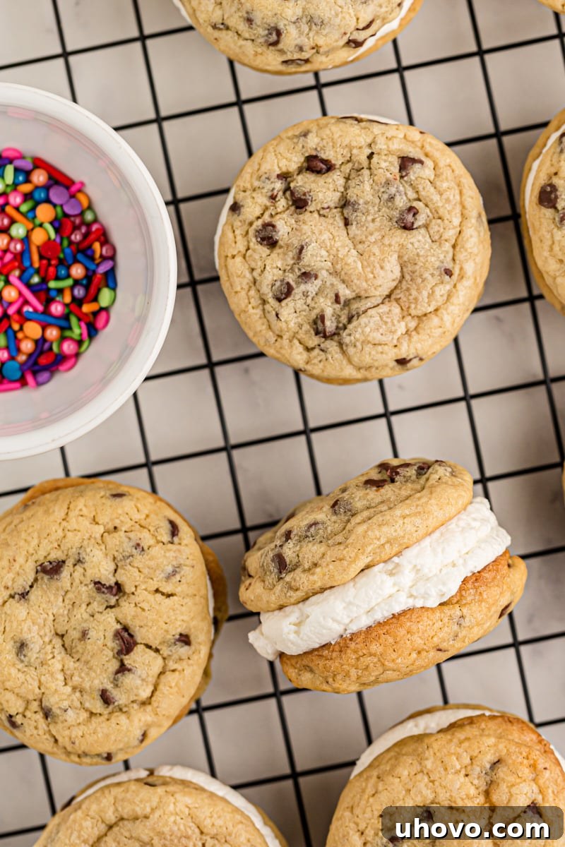 close up of Chocolate Chip Cookie Sandwiches on a wire rack with a bowl of colorful sprinkles