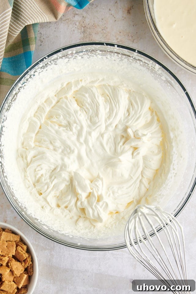 Overhead view of whipped cream in mixing bowl
