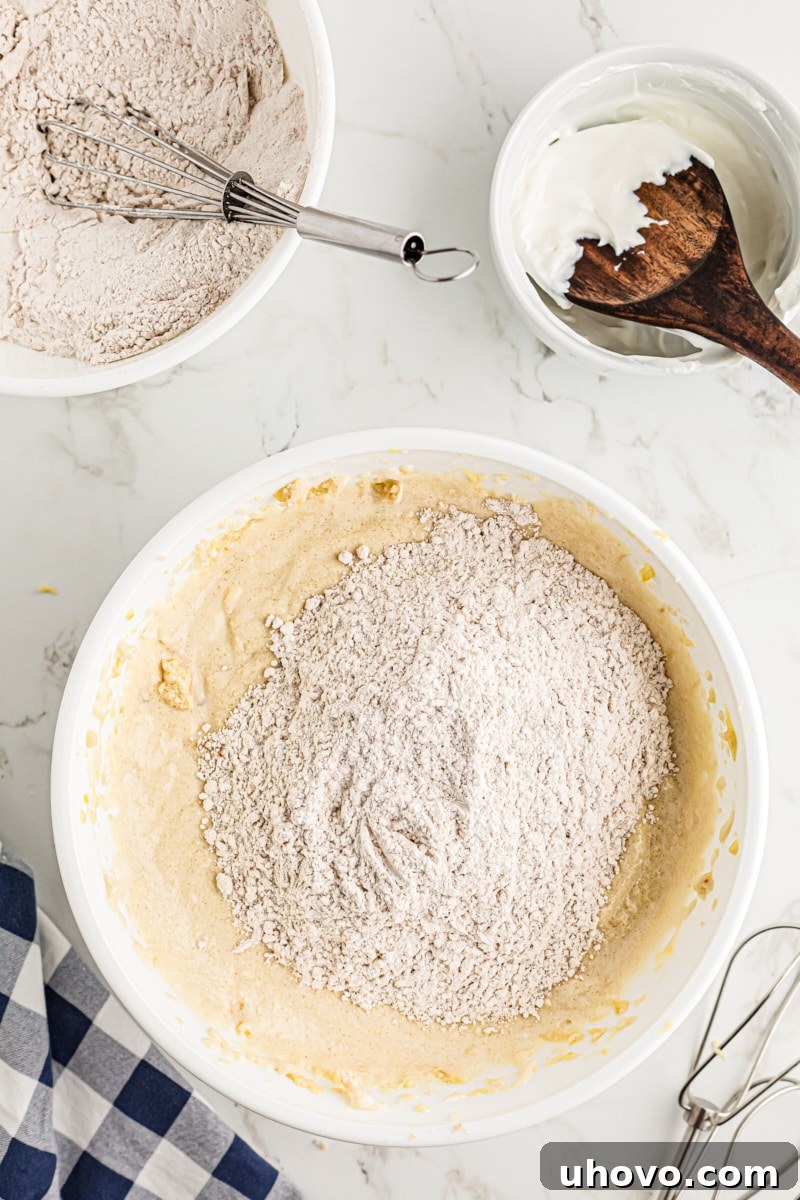 Adding the dry ingredients to the wet.
