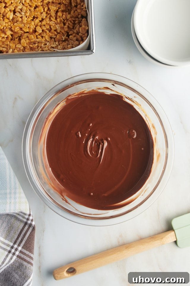 Overhead view of melted chocolate and butterscotch chips, smooth and ready to spread.