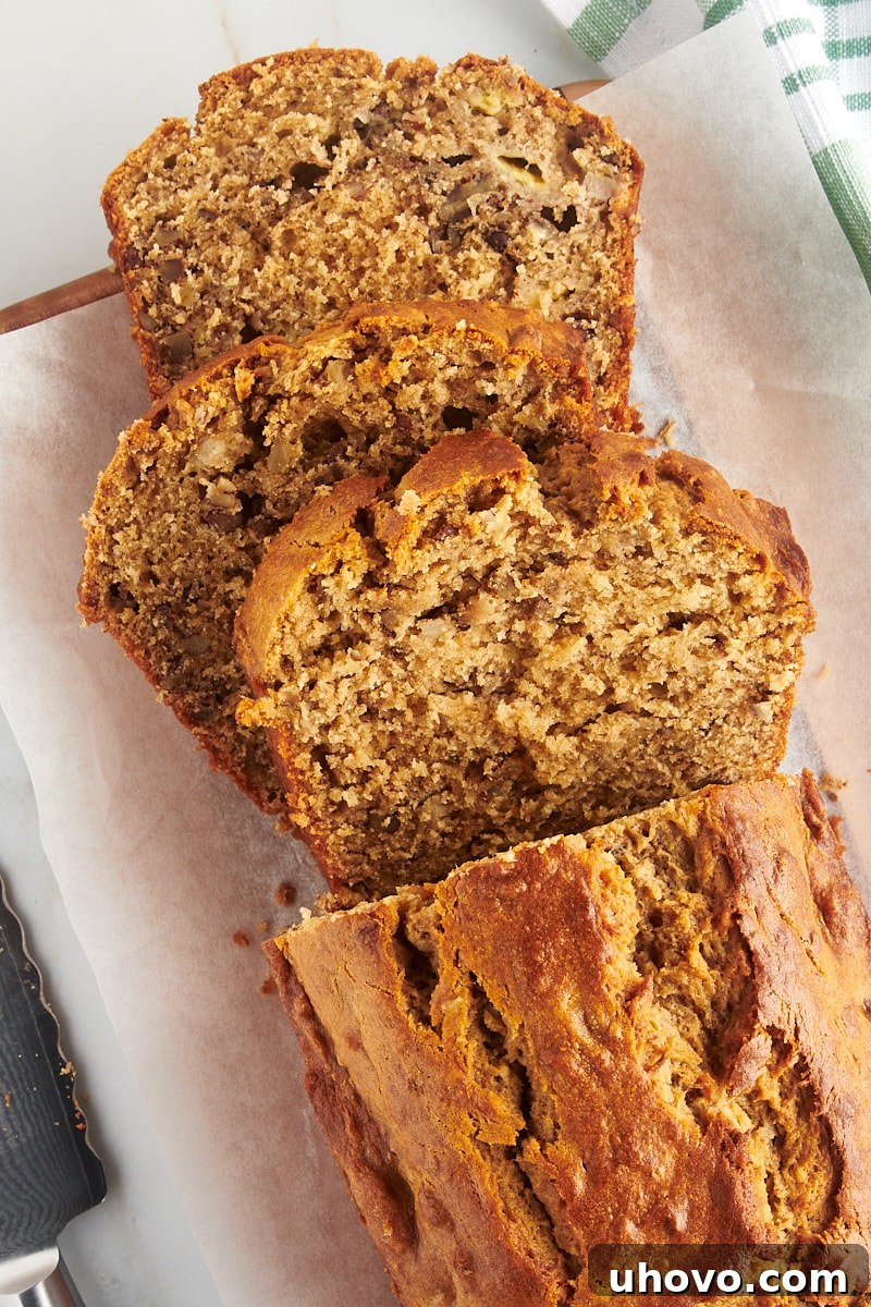 Overhead view of a perfectly sliced loaf of peanut butter banana bread, revealing its moist, tender crumb and inviting texture.
