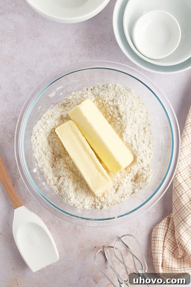 Overhead view of butter in bowl with dry ingredients
