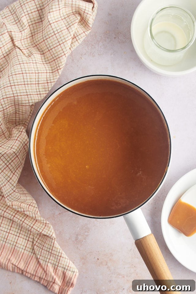 Overhead view of melted caramel in saucepan