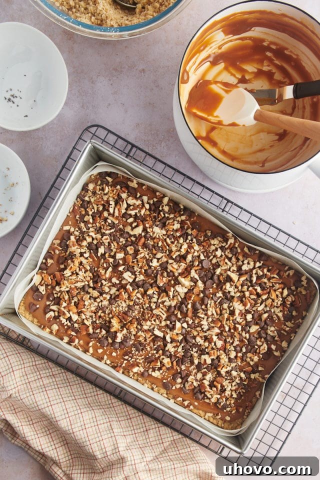 Overhead view of carmelitas in pan before adding oat topping