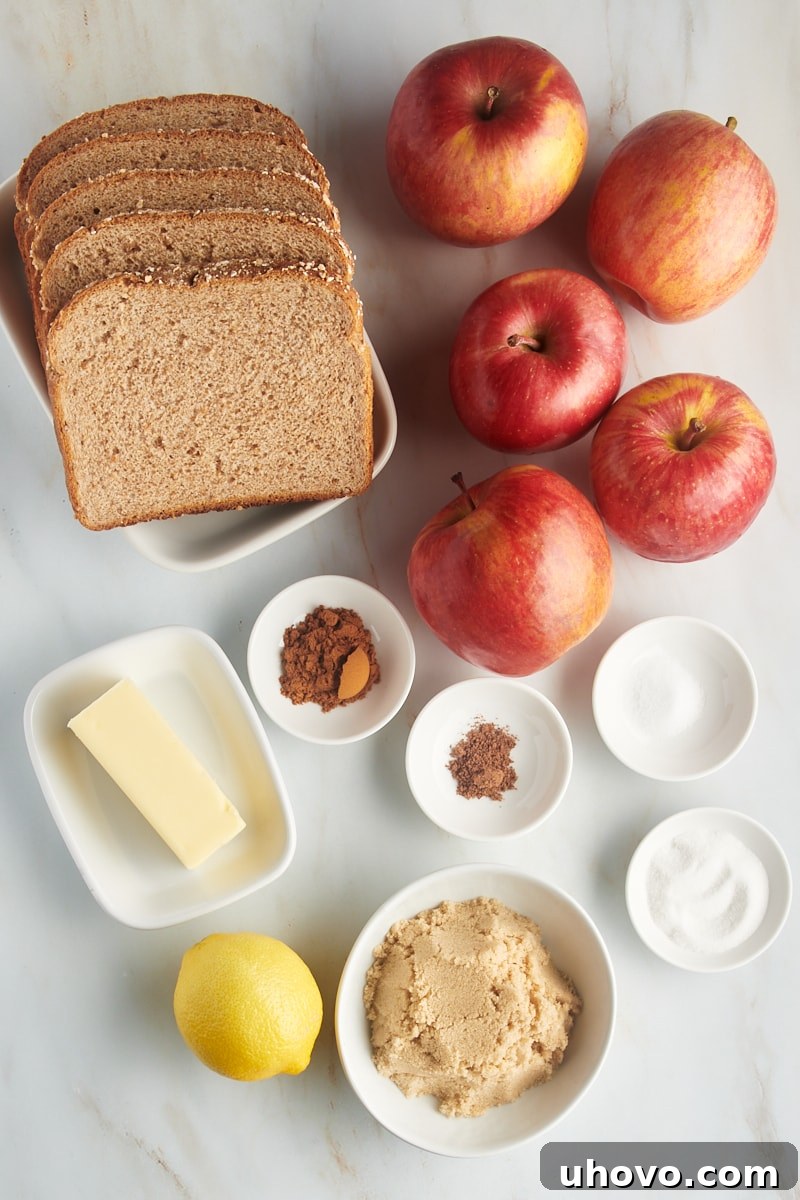 Overhead view of ingredients for Apple Brown Betty laid out on a table.