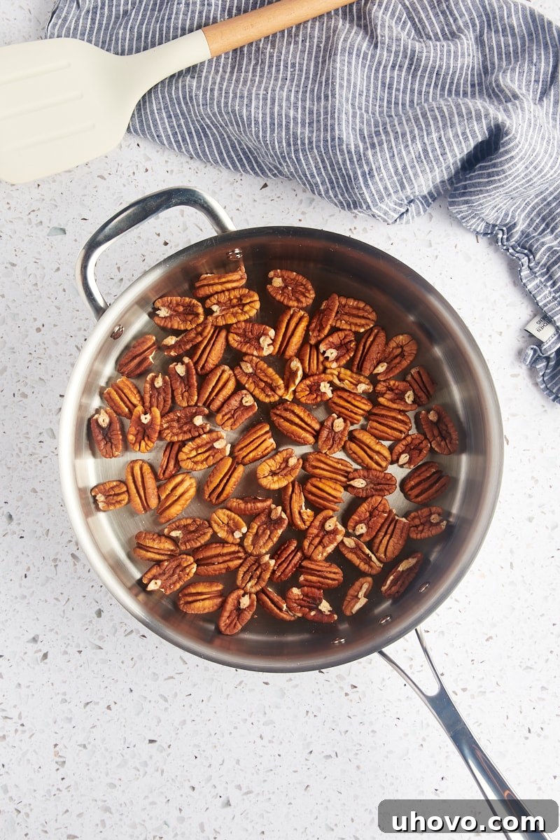 overhead view of pecan halves in a skillet
