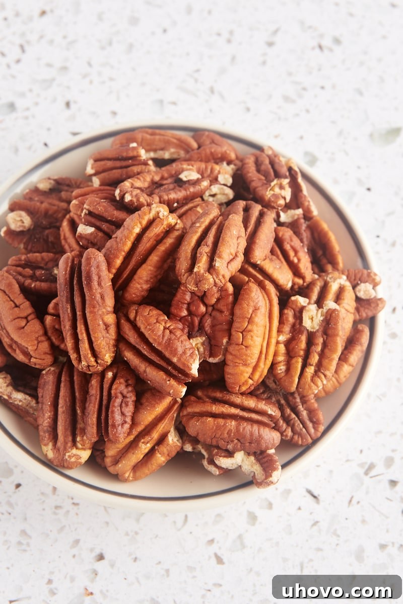 toasted pecans in a shallow bowl