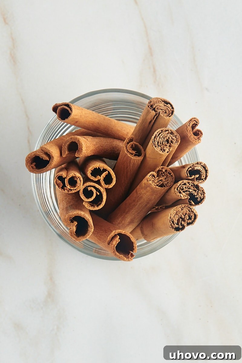 overhead view of cinnamon sticks in a glass
