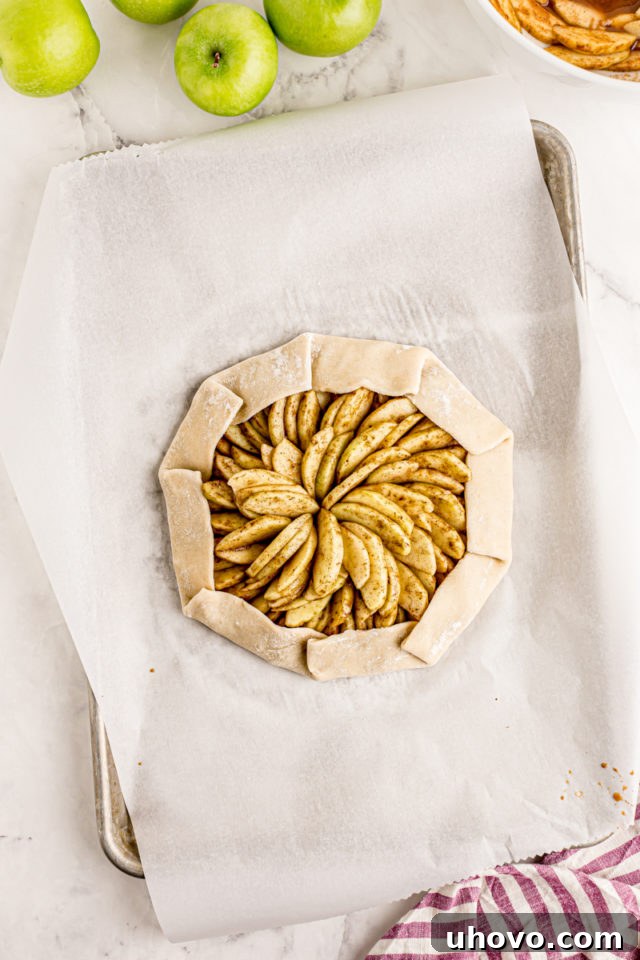 overhead view of apple galette with the crust partially folded over the filling